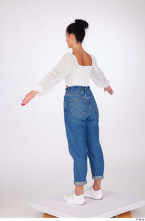 Suleika a-pose dressed high waist loose jeans standing white balloon…